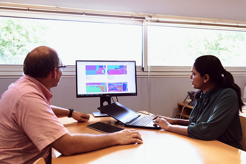 Two almacam's employees working on their nesting software Nest and Cut on the computer
